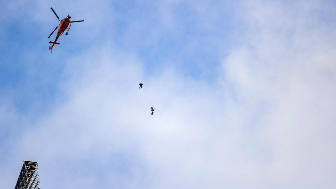 Yep, that’s Tom Cruise, spotted this week riding a motorbike off a clifftop ramp and parachuting to safety. Crazy. Picture: Norway OUT