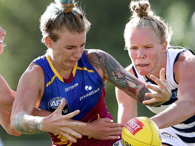 BRISBANE, AUSTRALIA - JANUARY 29: Phoebe Monahan of the Lions is tackled during the round four AFLW match between the Brisbane Lions and the Geelong Cats at Maroochydore AFC on January 29, 2022 in Brisbane, Australia. (Photo by Jono Searle/AFL Photos/Getty Images)