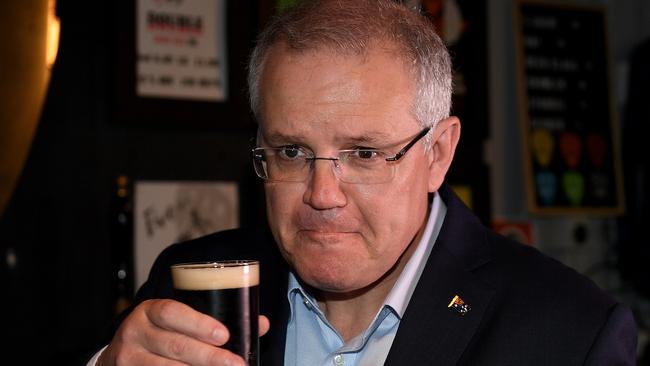 Prime Minister Scott Morrison drinks a beer during a visit to a brewery last week. AAP Image/Dan Himbrechts