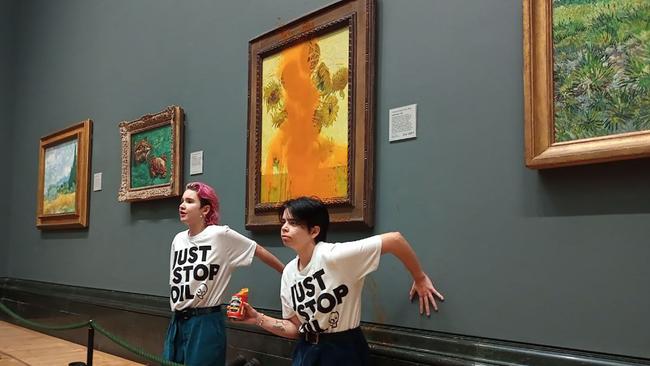 Climate crusaders glued their hands to the wall under Vincent van Gogh's "Sunflowers" after throwing tomato soup on the painting.