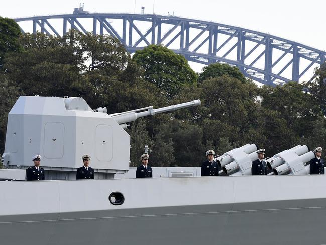 Chinese Navy personnel are seen onboard a Chinese Navel ship after it arrives at Garden Island Naval Base in Sydney, Monday, June 3, 2019. Australian Prime Minister Scott Morrison said it was a reciprocal visit after Australian naval vessels visited China and dismissed suggestions the timing was contentious given the anniversary of the Tiananmen Square massacre was on June 4. (AAP Image/Bianca De Marchi) NO ARCHIVING