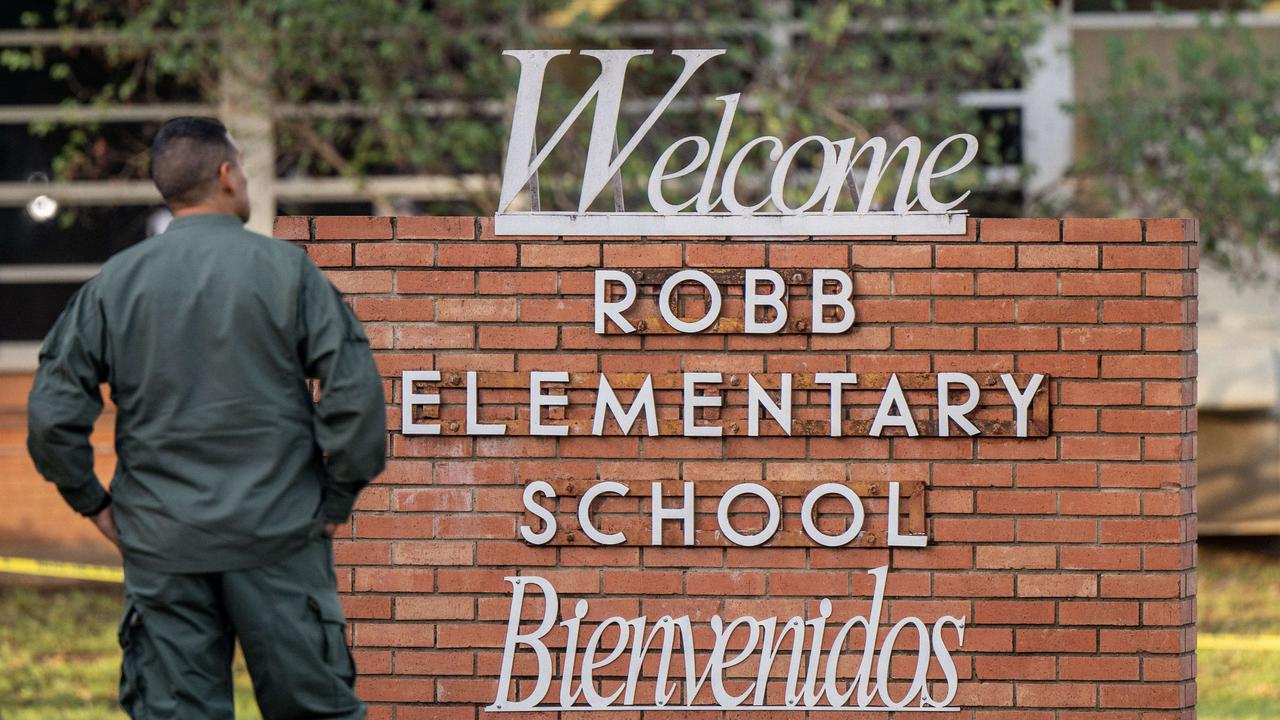 A law enforcement officer stands outside the Robb Elementary School where 19 children aged between seven and 10 were killed alongside two teachers. Picture: Brandon Bell/Getty Images/AFP