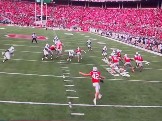 Joe McGuire punting for Ohio on Sunday.