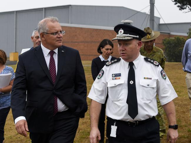 Prime Minister Scott Morrison with RFS Commissioner Shane Fitzsimmons at HMAS Albatross in Nowra. Picture: AAP