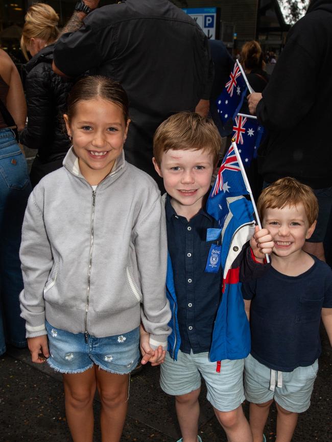 Thousands of people have braved the rain to gather in Brisbane for Anzac Day services. Picture: Grace Kessels