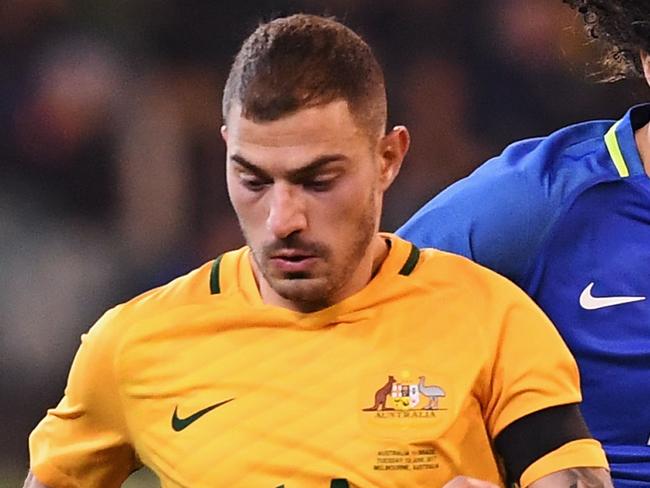 MELBOURNE, AUSTRALIA - JUNE 13:  James Troisi of the Socceroos competes for the ball ahead of David Luiz of Brazil during the Brasil Global Tour match between Australian Socceroos and Brazil at Melbourne Cricket Ground on June 13, 2017 in Melbourne, Australia.  (Photo by Michael Dodge/Getty Images for ICC)