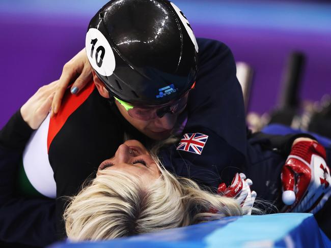 Sandor Liu Shaolin of Hungary embraces his girlfriend Elise Christie after winning gold in the men’s 5,000m short track relay. Photo: Getty Images