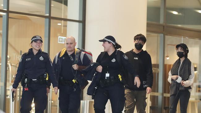 Police officers patrol a quarantine hotel in Brisbane’s CBD. Picture: Annette Dew