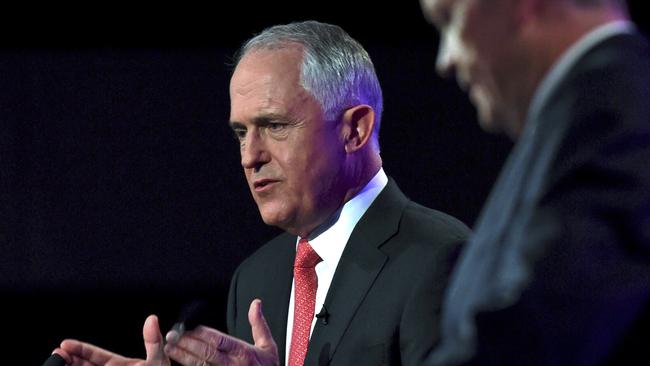 Prime Minister Malcolm Turnbull speaks as opposition leader Bill Shorten listens at a leaders' debate at the National Press Club in Canberra. Picture: Tracey Nearmy