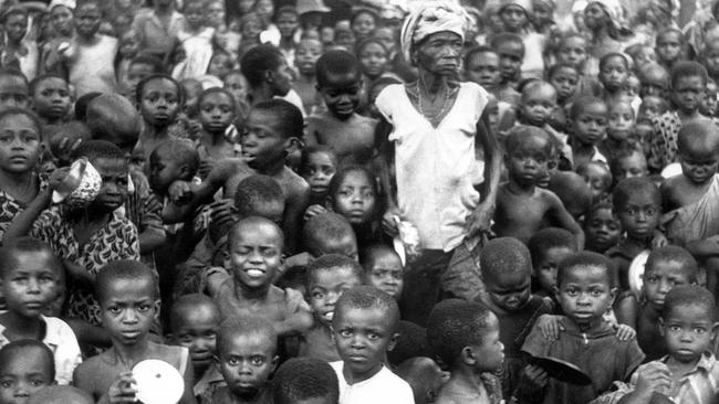 Refugees wait to receive food, on February 26 1969 in a camp in the Biafra region in southeastern Nigeria, where a civil war erupted. Picture: AFP PHOTO HO/STR