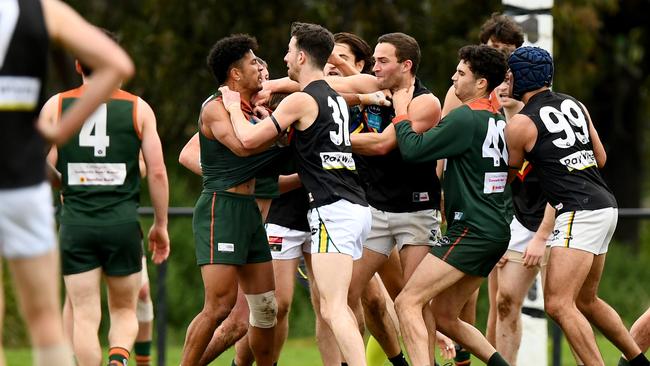 Players wrestle during the 2023 round 17 Victorian Amateur Football Association Division 1 Men's match between University High School - Victoria University Amateur Football Club and Glen Eira at Brens Oval in Parkville, Victoria on August 19, 2023. (Photo by Josh Chadwick)