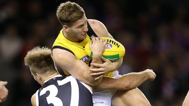 Kane Lambert crashes into St Kilda’s Bailey Rice after taking a mark. Picture: Michael Klein