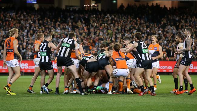 Players converge on a massive halftime melee. Pic: Michael Klein