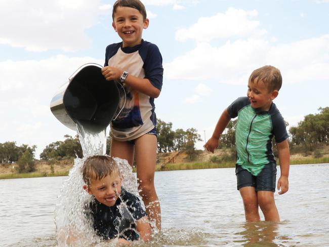 Ashton, 7, Lincoln, 5, and Elijah, 4, of Altona kept cool at Mildura's Apex Park on the Murray River as the mercury hit 46C.