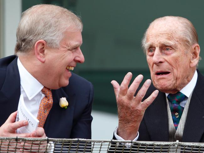 EPSOM, UNITED KINGDOM - JUNE 04: (EMBARGOED FOR PUBLICATION IN UK NEWSPAPERS UNTIL 48 HOURS AFTER CREATE DATE AND TIME) Prince Philip, Duke of Edinburgh and Prince Andrew, Duke of York watch the racing from the balcony of the Royal Box as they attend Derby Day during the Investec Derby Festival at Epsom Racecourse on June 4, 2016 in Epsom, England. (Photo by Max Mumby/Indigo/Getty Images)