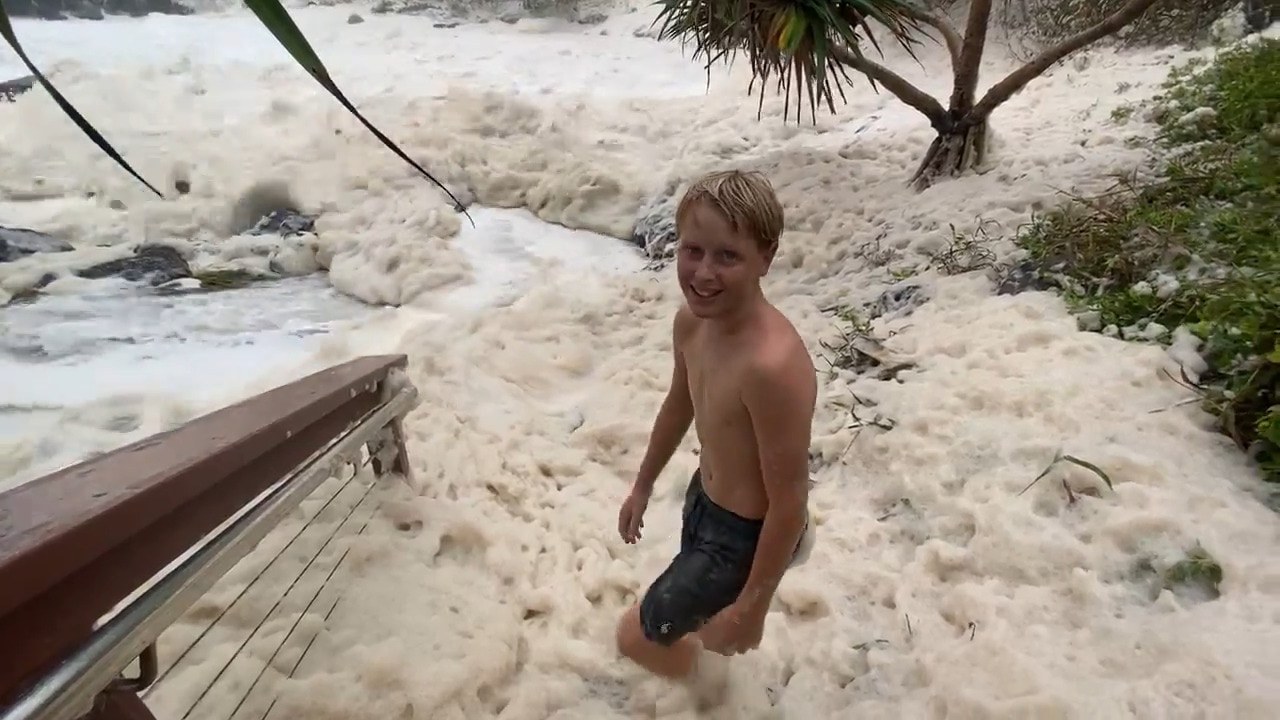 Kid outruns cyclone surf at Snapper Rocks