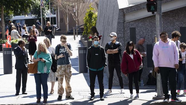 Residents wait outside Brisbane’s King George Square Station in the CBD. Picture: NCA NewsWire / Attila Csaszar 