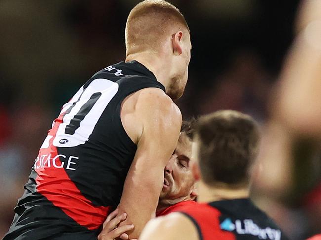 SYDNEY, AUSTRALIA - MARCH 23: Harry Cunningham of the Swans is challenged by Peter Wright of the Bombers during the round two AFL match between Sydney Swans and Essendon Bombers at SCG, on March 23, 2024, in Sydney, Australia. (Photo by Mark Metcalfe/AFL Photos/via Getty Images )