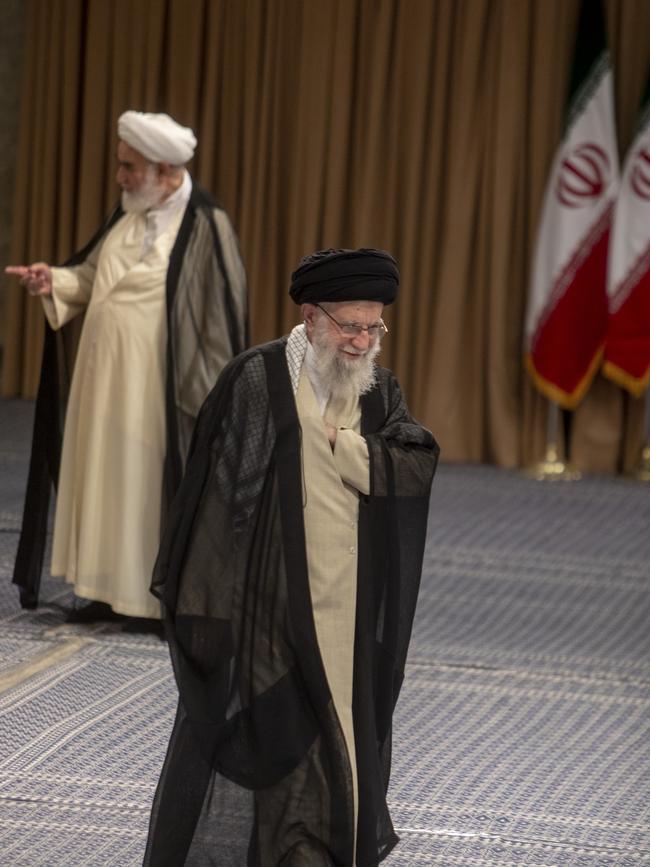 =Iranian Supreme Leader Ayatollah Ali Khamenei walks towards the ballot box to vote for the presidential runoff election. Picture: Getty