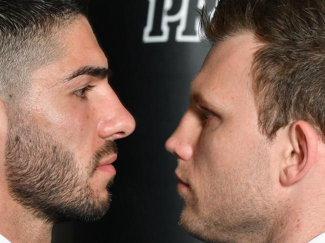 Michael Zerafa (left) and Jeff Horn facing off ahead of their fight at the Brisbane Convention Centre on December 18. (AAP Image/Darren England)