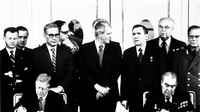 Mr Carter, left, and Soviet president Leonid Brezhnev sign the SALT II treaty in the Redoutensaal of the Imperial Hofburg Palace in Vienna in June 1979. Picture: AP