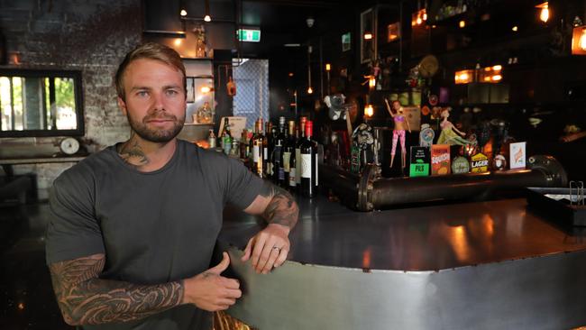 Ze Pickle co-director Aaron Wilson out the front of the shop, which is only open for takeaway. Wilson supports restrictions being eased, but worries about big crowds and the potential for COVID-19 to spread. Picture: Glenn Hampson