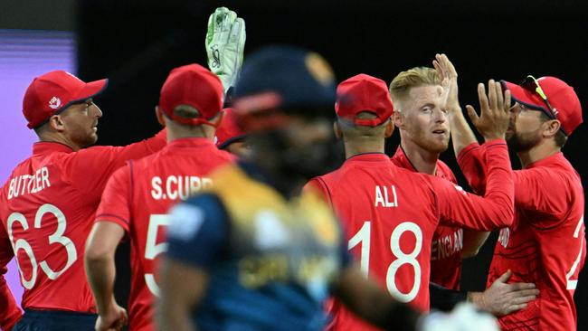 England's Ben Stokes (2nd R) celebrates the wicket of Sri Lanka's Charith Asalanka.