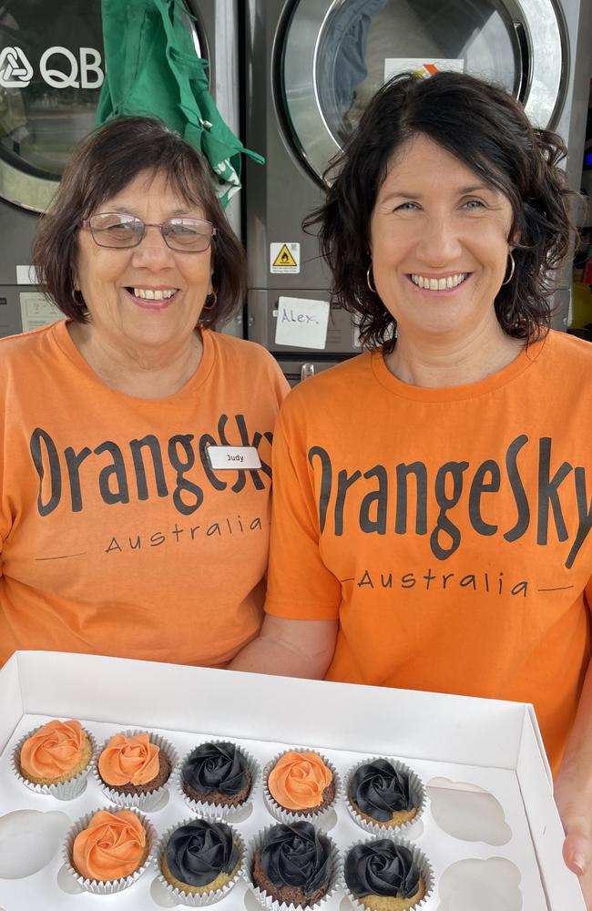 Orange Sky volunteers Judy Riddel and Katrina Dent celebrated 5 years with cupcakes in October 2022. Photo: Zoe Devenport