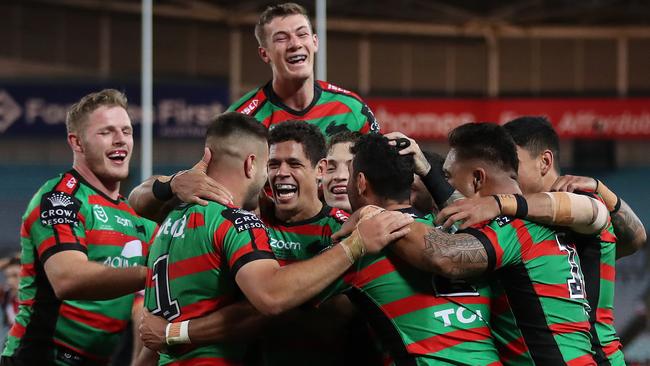 Souths players celebrate after Souths Alex Johnston scored his 4th try. Picture: Brett Costello