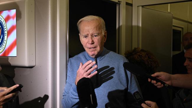 Joe Biden speaks to reporters aboard Air Force One on his return flight from Israel this week. Picture: AFP