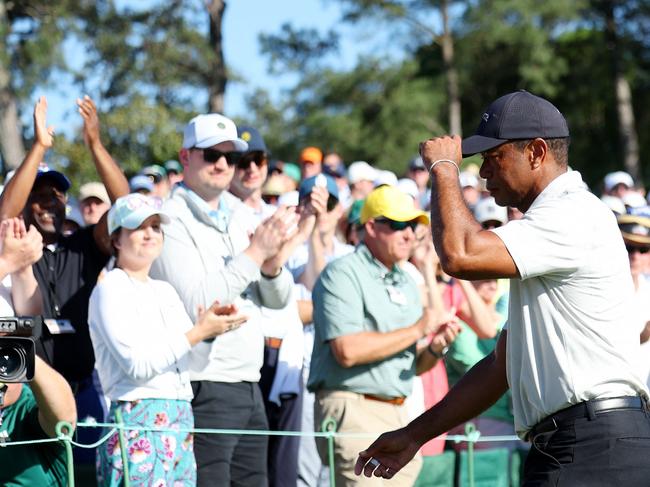 AUGUSTA, GEORGIA - APRIL 13: Tiger Woods of the United States acknowledges the crowd walking off the 18th green during the third round of the 2024 Masters Tournament at Augusta National Golf Club on April 13, 2024 in Augusta, Georgia.   Andrew Redington/Getty Images/AFP (Photo by Andrew Redington / GETTY IMAGES NORTH AMERICA / Getty Images via AFP)