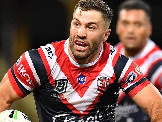 James Tedesco of the Roosters steps through the Broncos defence to score during the Round 4 NRL match between the Sydney Roosters and the Brisbane Broncos at the SCG in Sydney, Thursday, April 4, 2019. (AAP Image/Dean Lewins) NO ARCHIVING, EDITORIAL USE ONLY