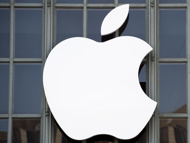 (FILES) This file photo taken on September 7, 2016 shows the Apple logo on the outside of Bill Graham Civic Auditorium in San Francisco, California. Apple sent out invitations on August 31, 2017 to a first-ever media event in the Steve Jobs Theater at its new "spaceship" campus in Silicon Valley. The keenly anticipated event set for September 12 is expected to star iPhone models marking the tenth anniversary of the culture-changing smartphones. In trademark style, Apple revealed little in the invitation that provided the date, time, location and a message that read "Let's meet at our place."  / AFP PHOTO / Josh Edelson