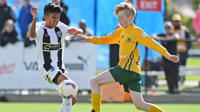 Under-12 cup final opponents Thinura Wagaarachchi, of Adelaide City, and Hugo Borda, of Cumberland United, battle for the ball. Picture: Tom Huntley