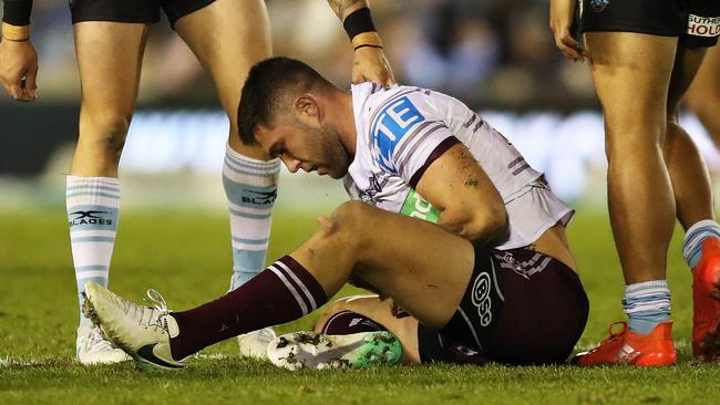 Manly's Curtis Sironen is injured during Sunday’s game against Cronulla. Picture: Brett Costello