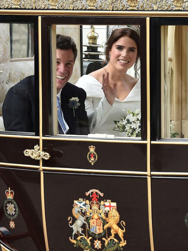 The pair travel in the Scottish State Coach at the start of their carriage procession. Picture: AFP