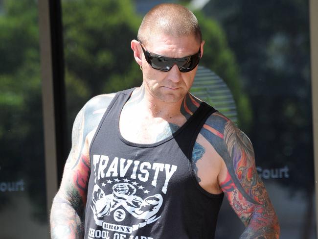 Former Finks bikie Mark Sandery arrives at Port Adelaide Magistrates court to face various traffic and community service offences. His son was shot in the leg during a home invasion recently.