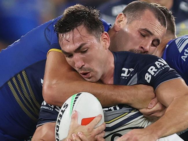 SYDNEY, AUSTRALIA - APRIL 13: Reece Robson of the Cowboys is tackled by Reagan Campbell-Gillard of the Eels during the round six NRL match between Parramatta Eels and North Queensland Cowboys at CommBank Stadium on April 13, 2024 in Sydney, Australia. (Photo by Jason McCawley/Getty Images)