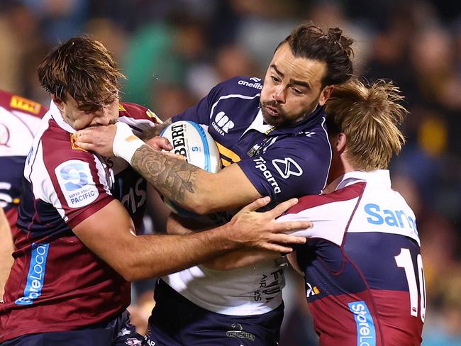 Andy Muirhead is tackled by the Reds defence. Picture: Getty Images