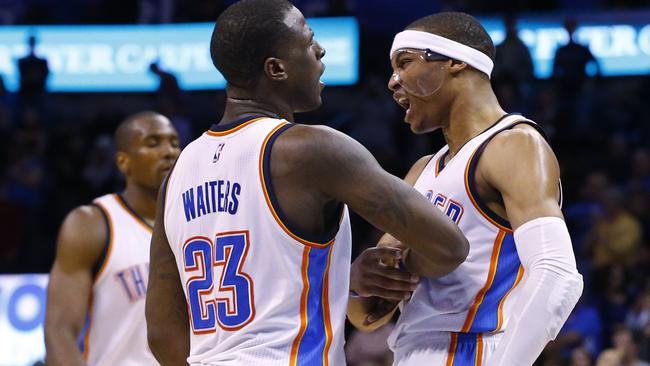 Oklahoma City Thunder guard Dion Waiters and guard Russell Westbrook celebrate in overtime.