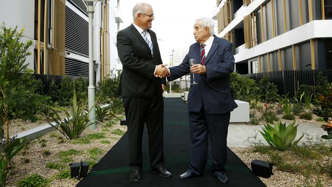 Meriton’s Harry Triguboff shaking hands with the now Prime Minister Scott Morrison (then Federal Treasurer) at the opening of the first Meriton block earlier this year. Picture: John Appleyard