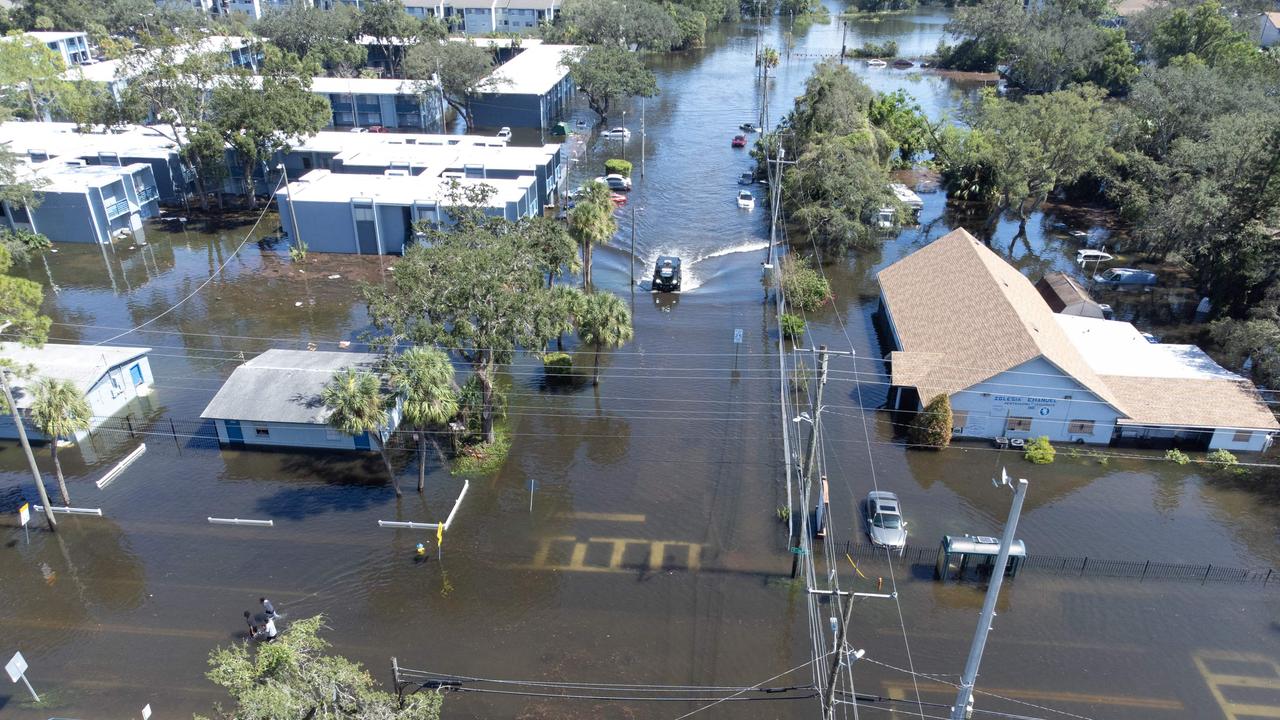 A drone image of a Sheriffâs Department vehicle moving through flooded streets in Tampa due to Hurricane Milton on October 10, 2024 in Florida. Hurricane Milton tore a coast-to-coast path of destruction across the US state of Florida, whipping up a spate of deadly tornadoes that left at least four people dead, but avoiding the catastrophic devastation officials had feared. (Photo by Bryan R. SMITH / AFP)