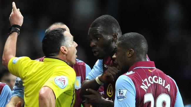 Aston Villa's Christian Benteke, second right, is red carded by referee Neil Swarbrick.