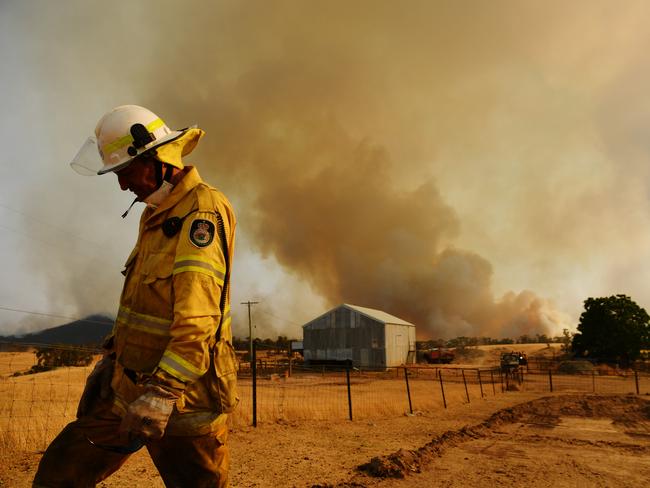 TUMURUMBA, AUSTRALIA - JANUARY 11: A Rural Fire Service firefighter Trevor Stewart views a flank of a fire on January 11, 2020 in Tumburumba, Australia. Cooler temperatures forecast for the next seven days will bring some reprieve to firefighters in NSW following weeks of emergency level bushfires across the state, with crews to use the more favourable conditions to contain fires currently burning. 20 people have died in the bushfires across Australia in recent weeks, including three volunteer firefighters. About 2079 homes have been destroyed this bushfire season in NSW, more than half of them since January 1, and 830 homes have been damaged. (Photo by Sam Mooy/Getty Images) ***BESTPIX***