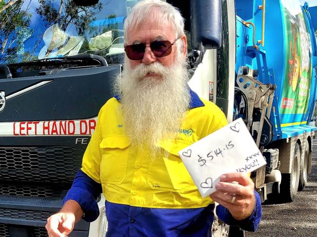 Ned, a Glenwood Garbage man receiving his donation of $514