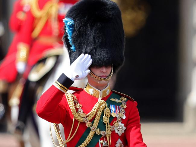 Prince William in his role as Colonel of the Irish Guards, salutes from his horse during the Queen's Birthday Parade, Trooping the Colour. Picture: AFP