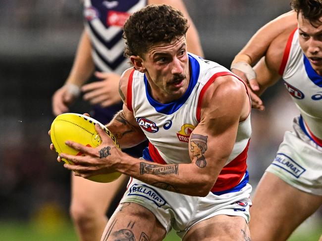 PERTH, AUSTRALIA - APRIL 21: Tom Liberatore of the Bulldogs looks for an option during the 2023 AFL Round 06 match between the Fremantle Dockers and the Western Bulldogs at Optus Stadium on April 21, 2023 in Perth, Australia. (Photo by Daniel Carson/AFL Photos via Getty Images)