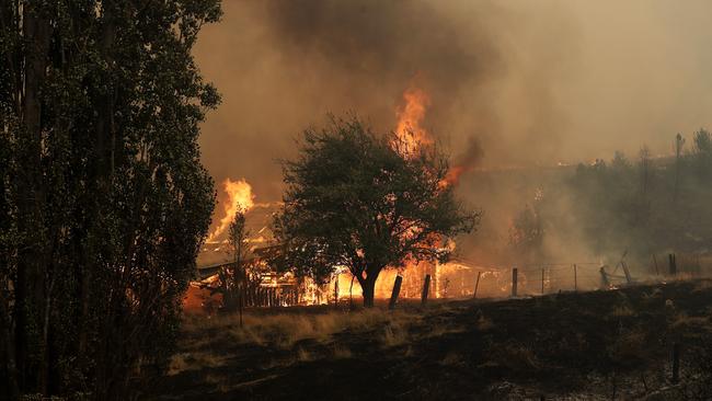 An outbuilding is engulfed in flames on Donnelleys Rd, Geeveston, Picture: LUKE BOWDEN