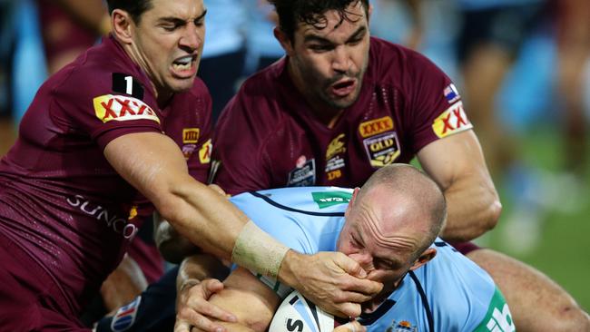 Billy Slater tries to prevent Beau Scott from scoring and fails in Origin 1. Picture Gregg Porteous