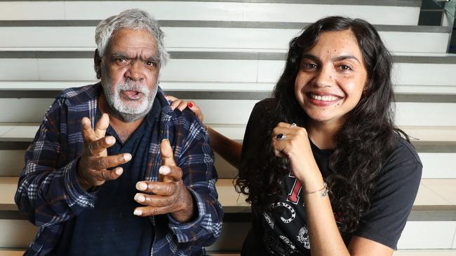 Warump Band Guitarist Sammy Butcher with his daughter Anyupa. Picture: John Feder